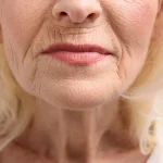 An older woman's face with wrinkles